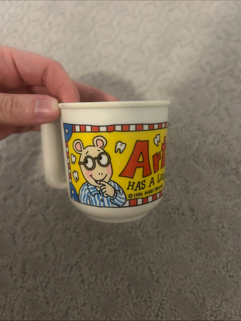 1990s Arthur has a loose tooth plastic cup